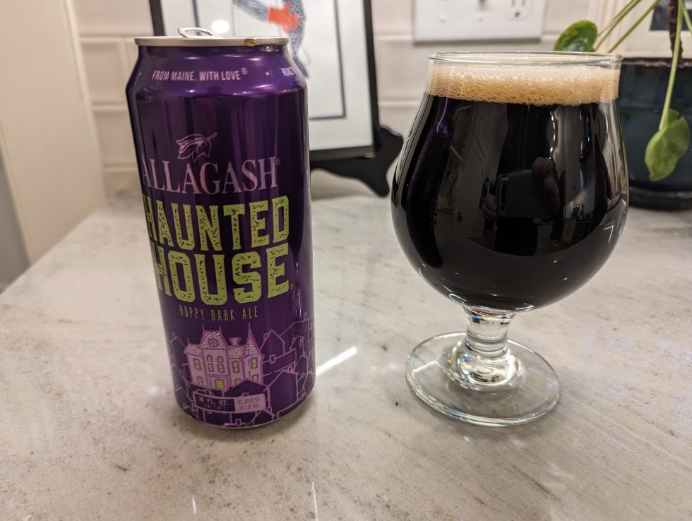 Chalice-style beer glass containing Allagash's Haunted House beer