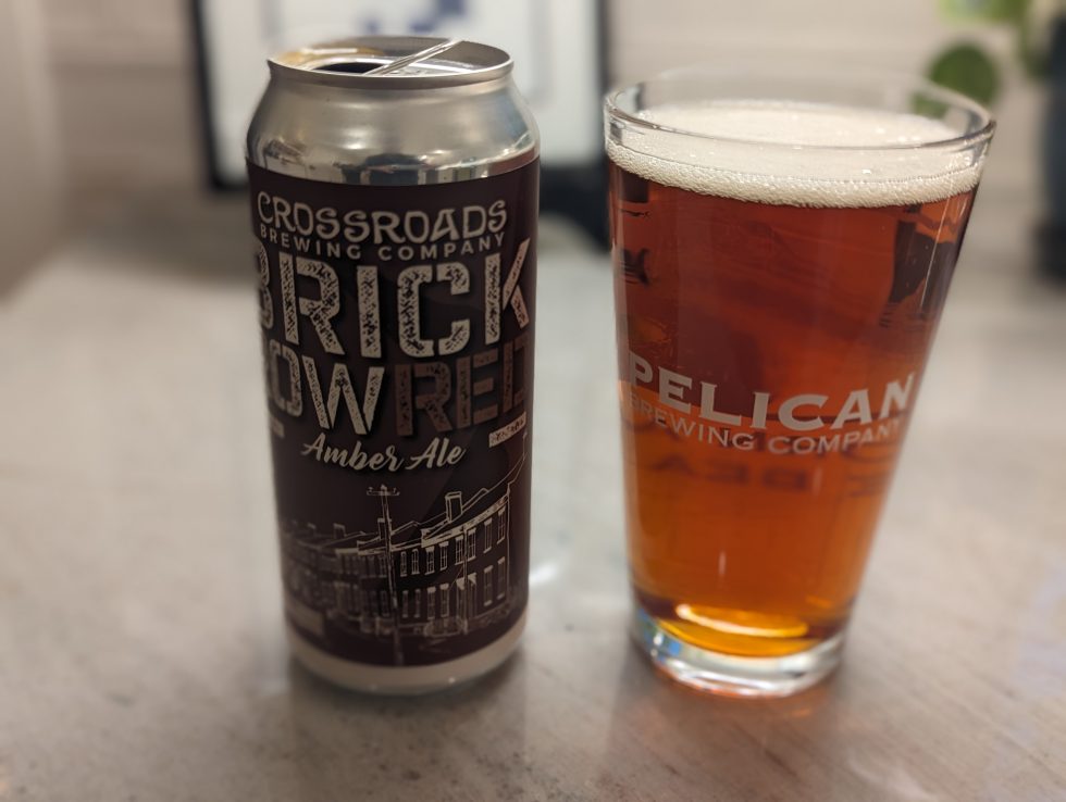 Photo of a pint glass containing a Brick Row Red beer