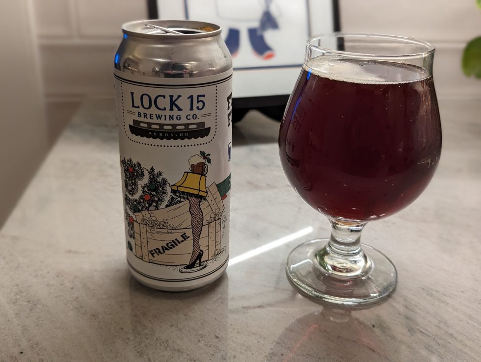 Photo of a pint glass containing a Fragile Festivus Christmas Ale