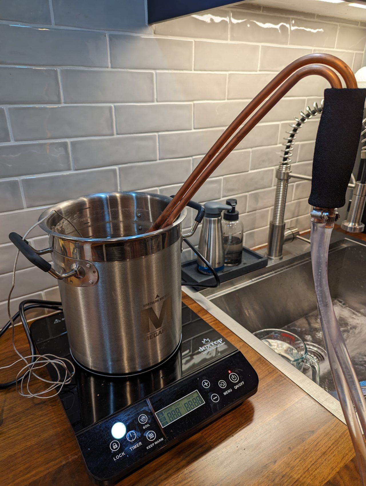 Photo of a two-gallon pot with a small copper immersion chiller in it