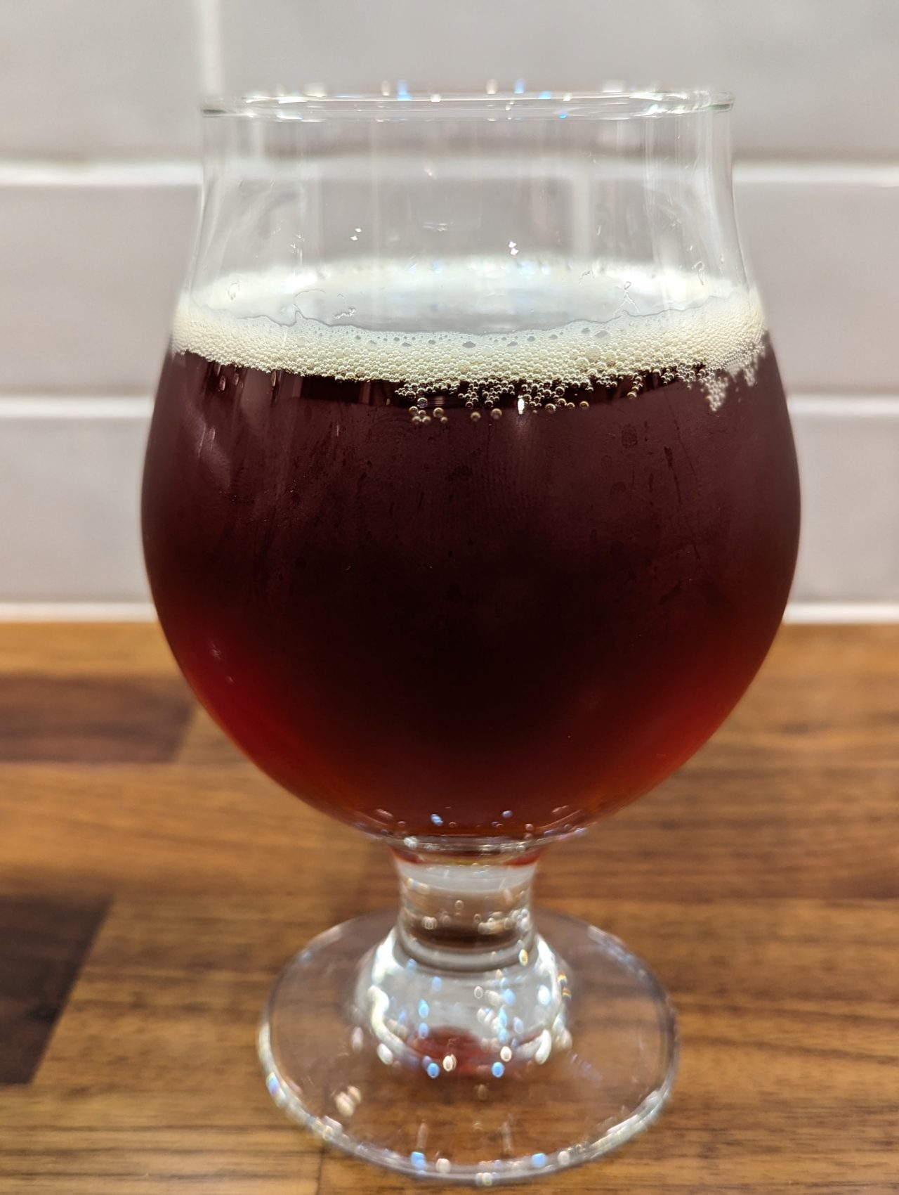Photo of Great Lakes Christmas Ale in a chalice-style glass.