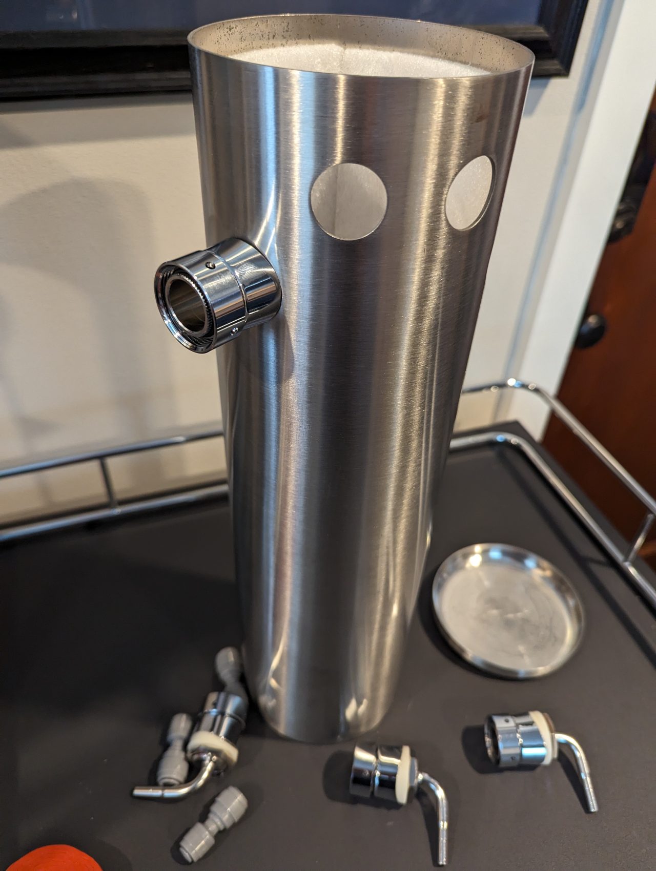 Photo of the outside of a beer tower with a single tap shank installed