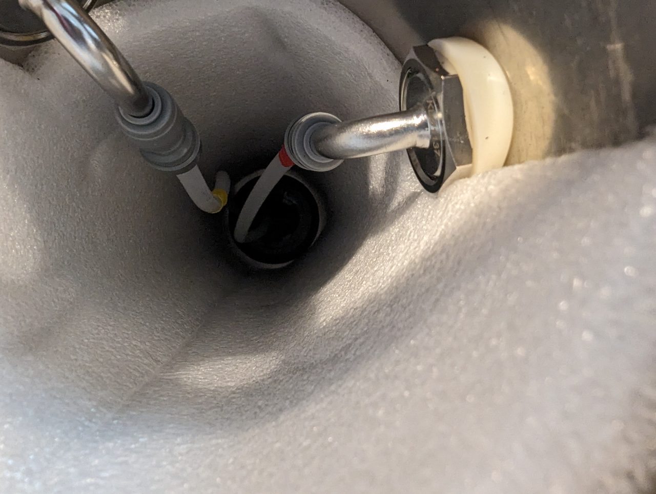 Photo of inside of a beer tap tower with a second beer line installed