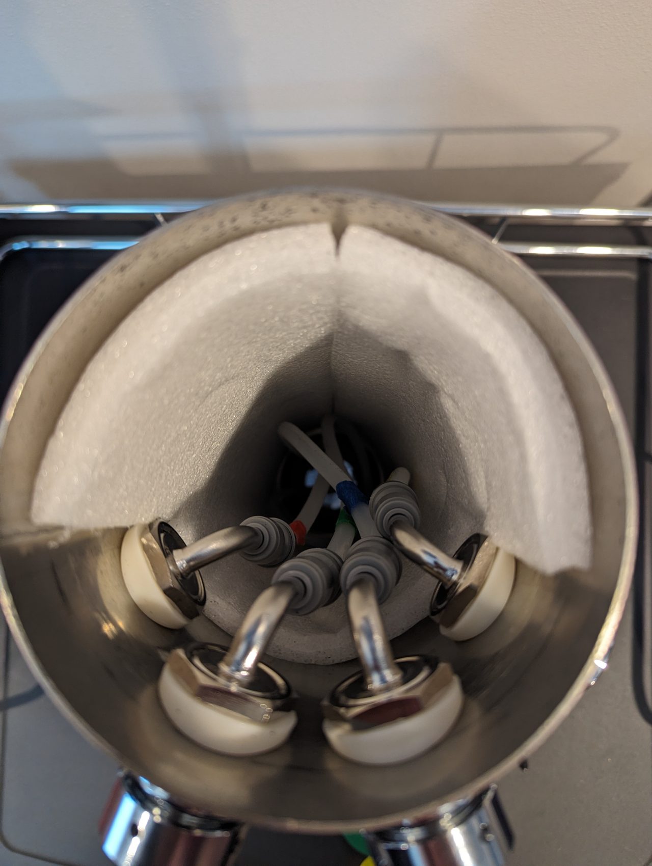 Photo of the inside of a beer tower with four beer lines installed