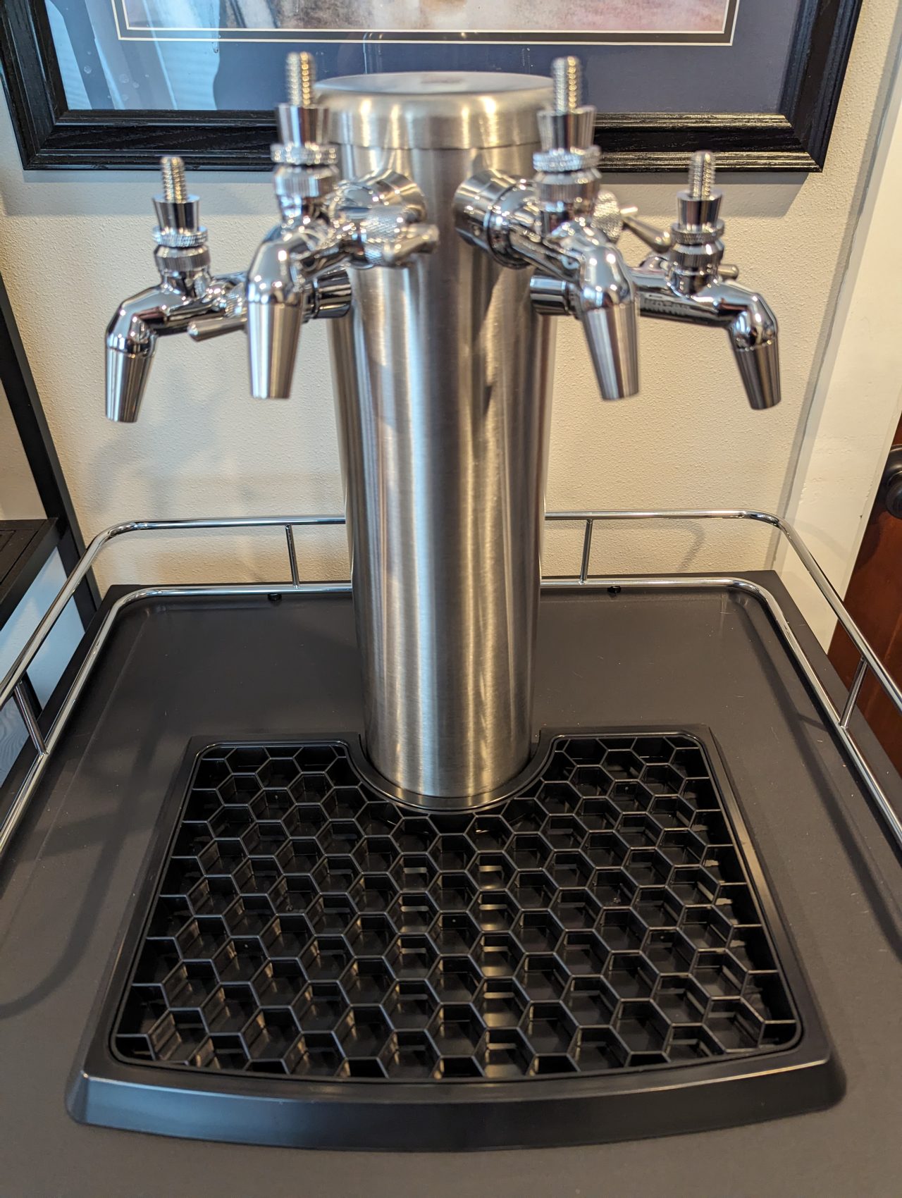 Photo of a beer tower with four faucets installed