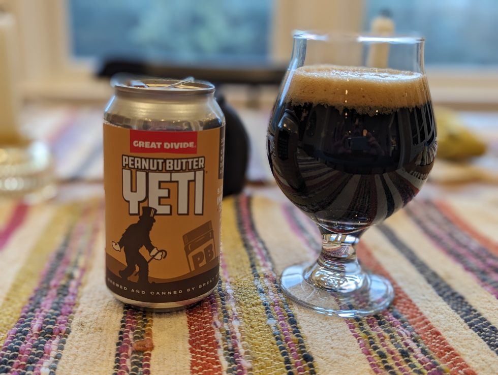 Photo of a can of Peanut Butter Yeti Imperial Stout poured into a chalice-style glass