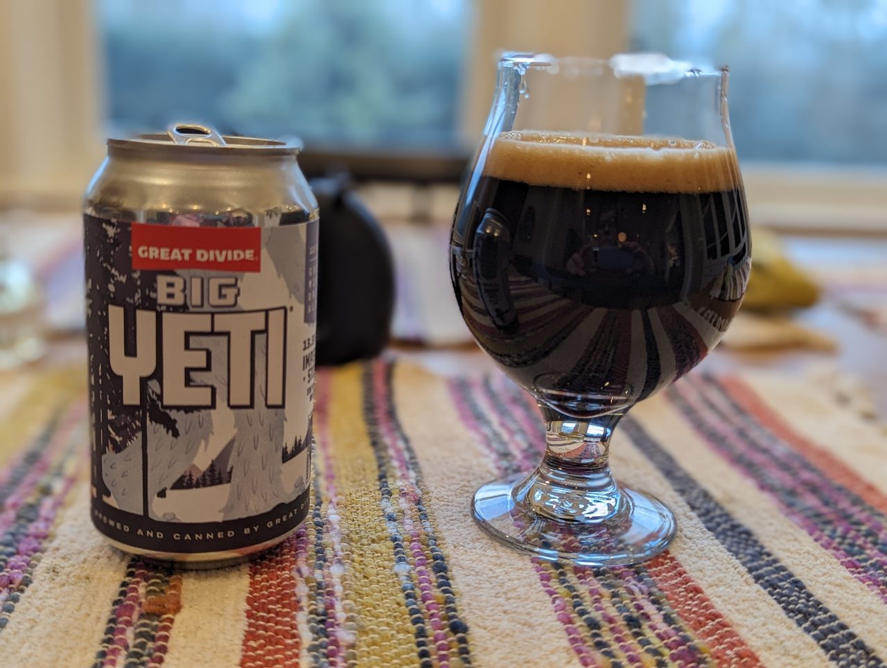 Photo of a can of Big Yeti beer poured into a chalice-style glass
